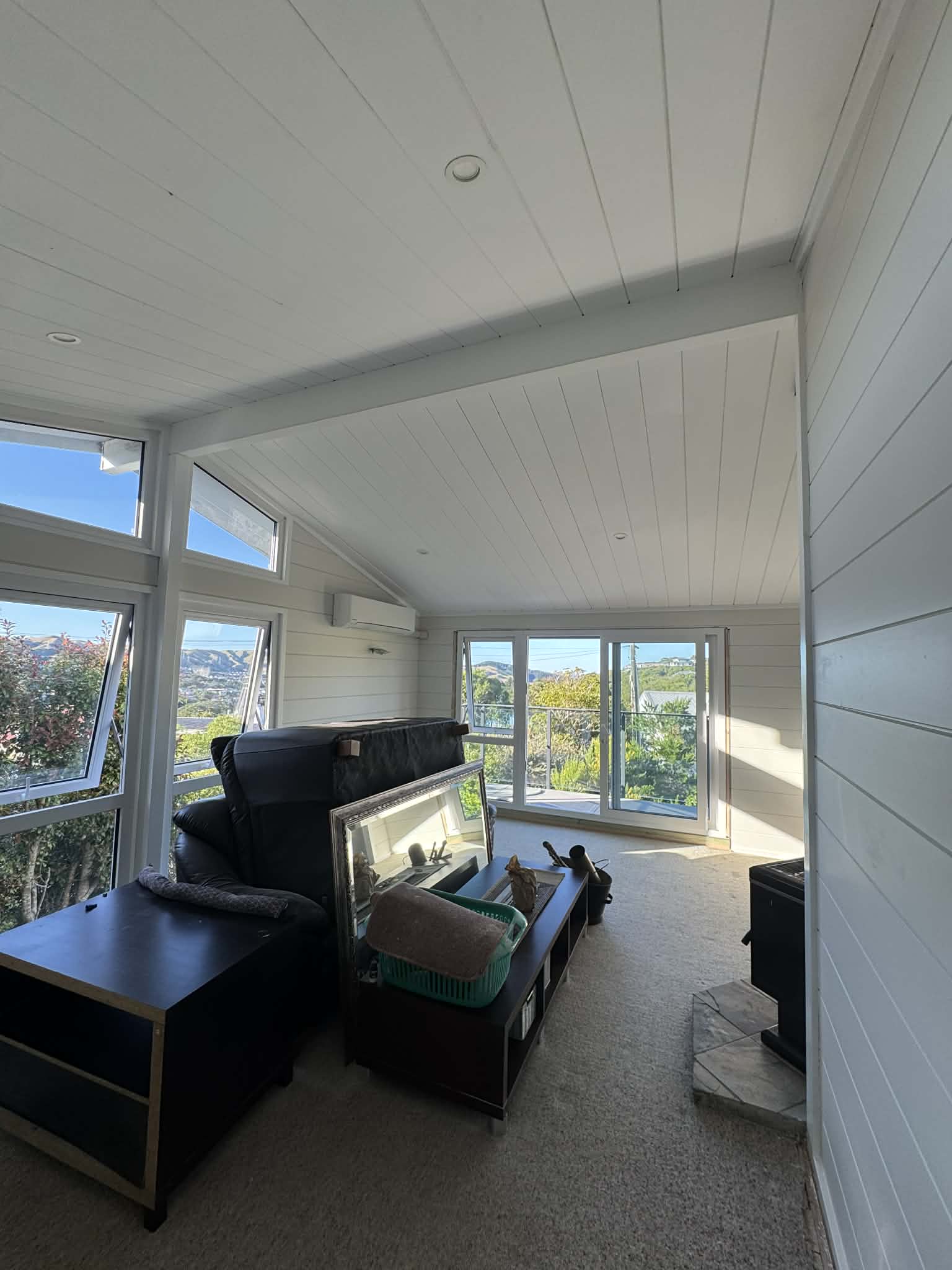 Interior painting sunroom with white tongue and groove ceiling — Renoval Pro NZ Wellington